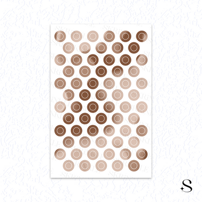 Sheet of circular cute journal stickers in brown and beige on a white background