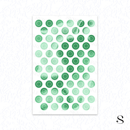 Sheet of green circular cute journal stickers on a white background